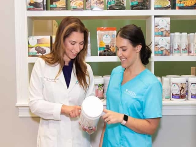 Smiling women with various Medi-Weightloss products