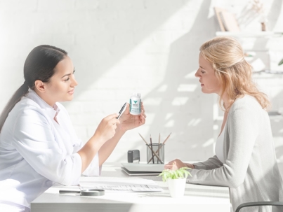 Clinician talking to a patient about Medi-Weightloss supplement.