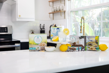Medi-Weightloss snacks and supplements displayed on a kitchen counter with lemons. | Medi-Weightloss
