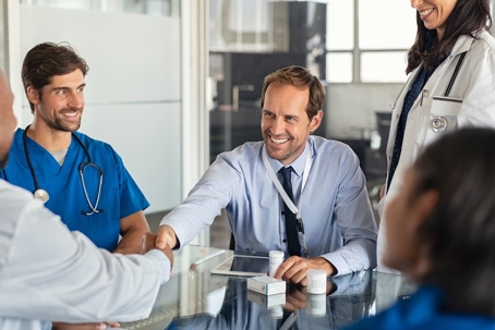 Doctor smiling at patient.