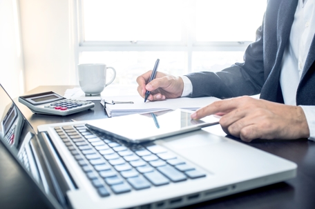 tight crop of man and laptop